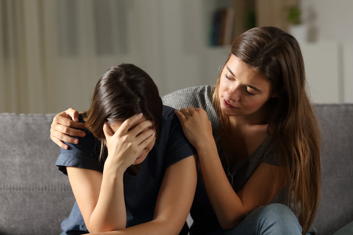 Teen comforting hes sad friend in the night